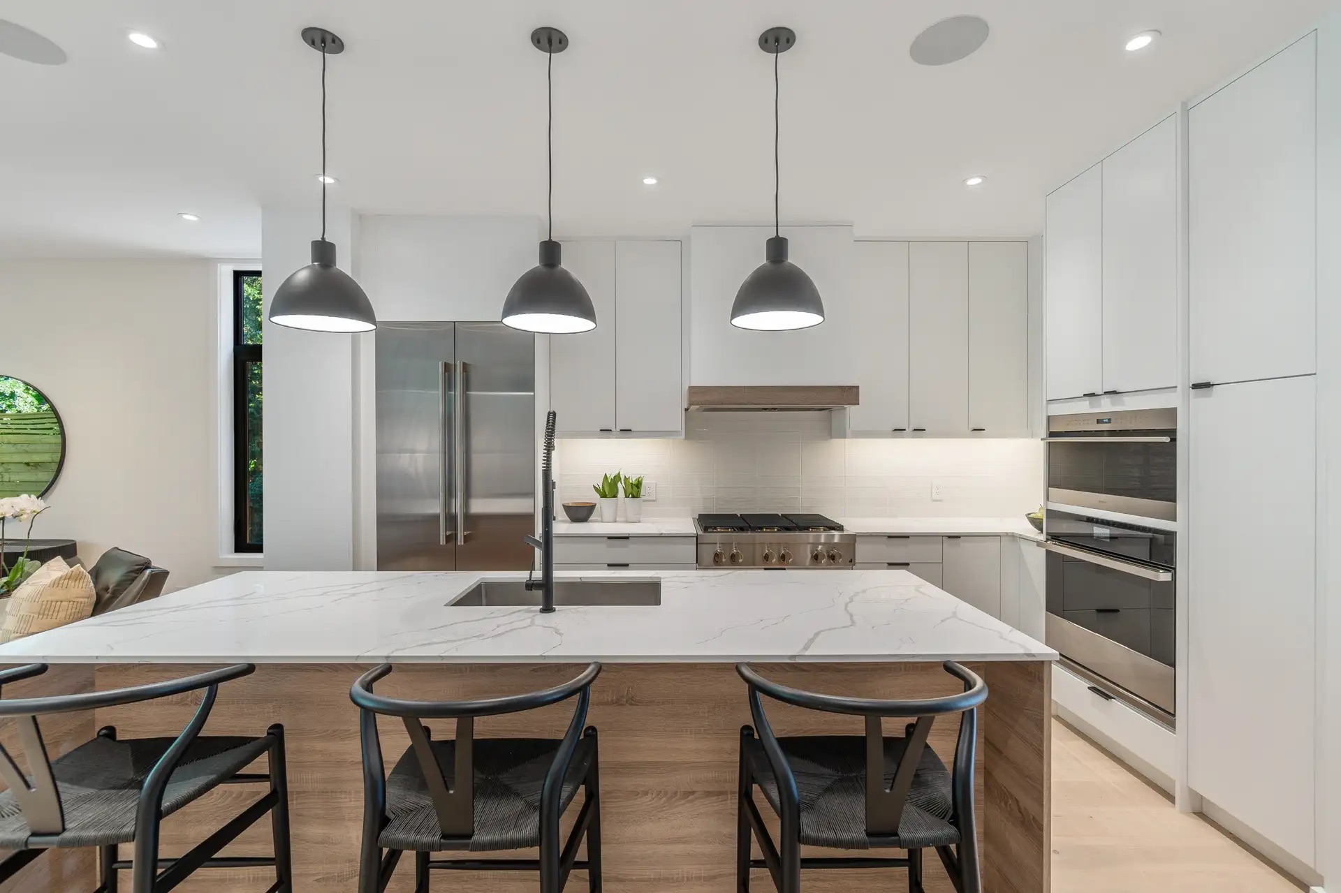 Modern white kitchen with wood island