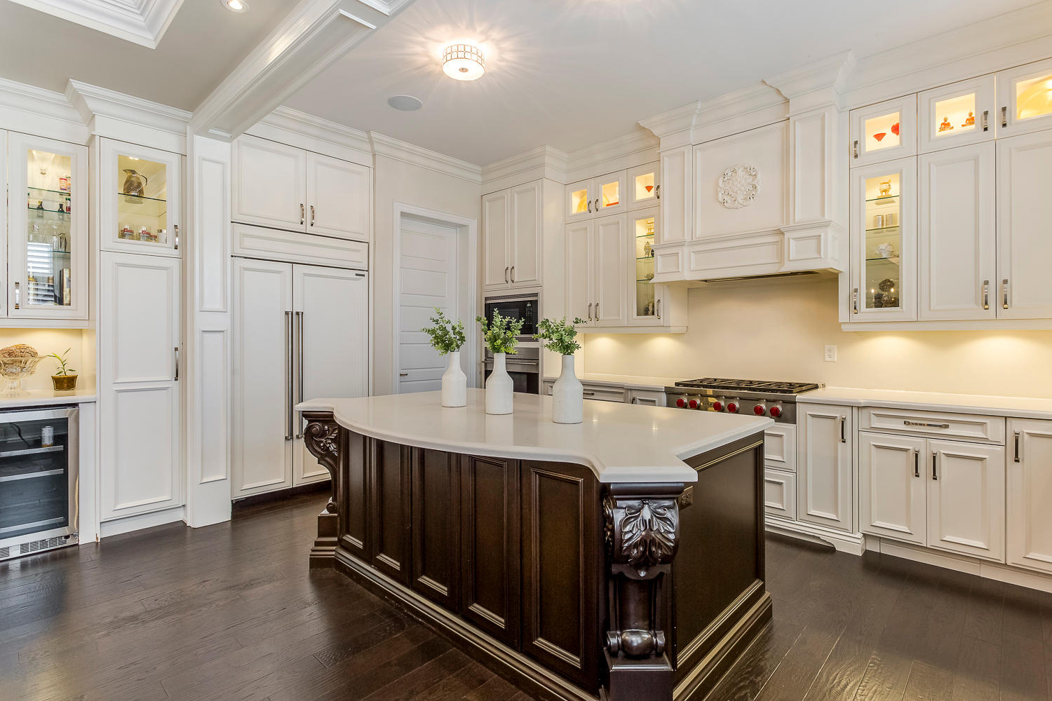 Dark wood island with white cabinetry