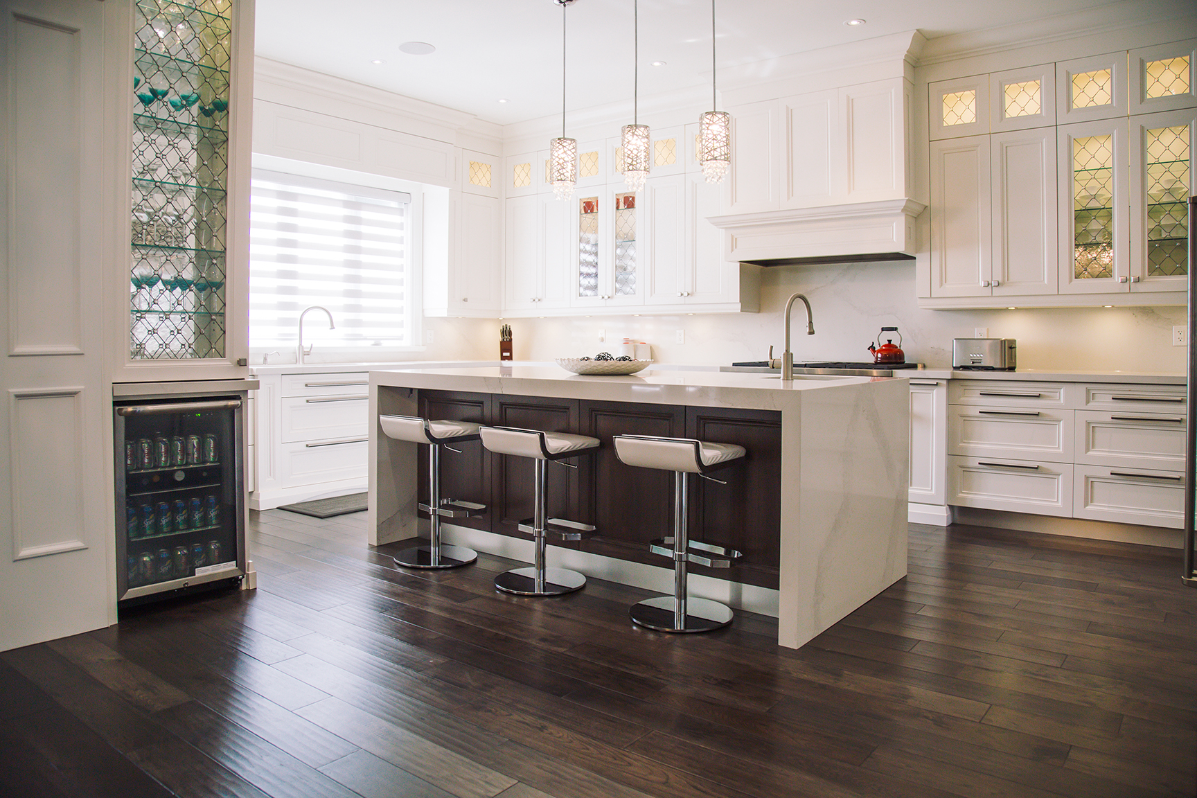 Cream classic kitchen with glass pendants
